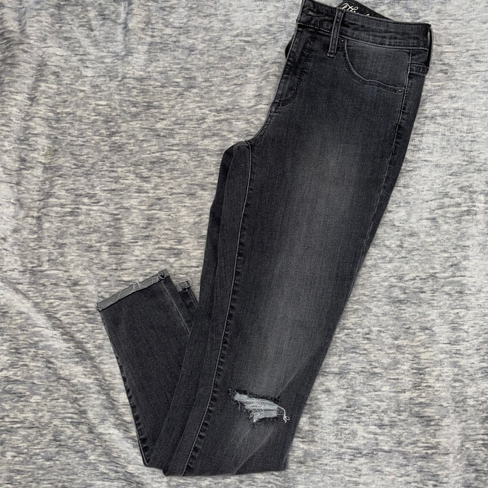 High rise gray skinny jeans with rip in the knee